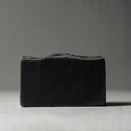 Dark handmade soap bar with charcoal
